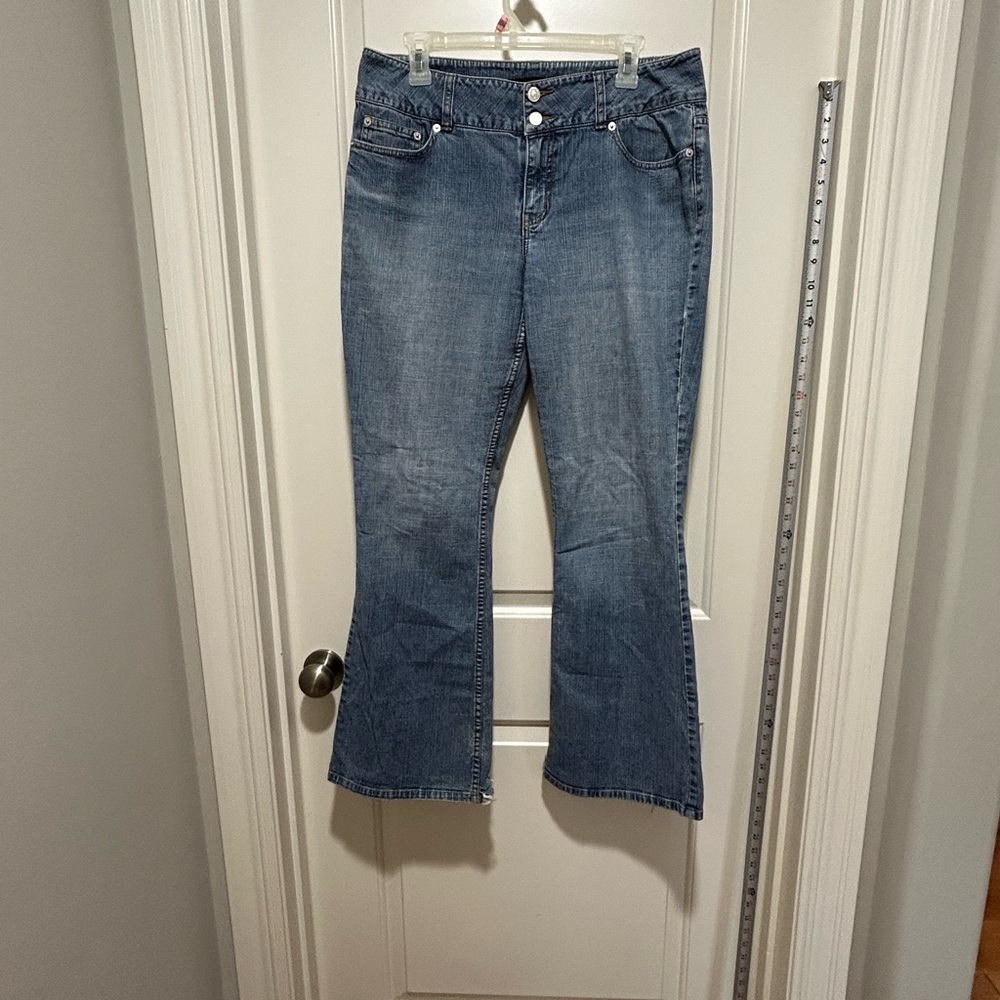 LONDONJEAN women’s size 12 Classic Denim Flare Jeans. Raw edge and 5 pockets